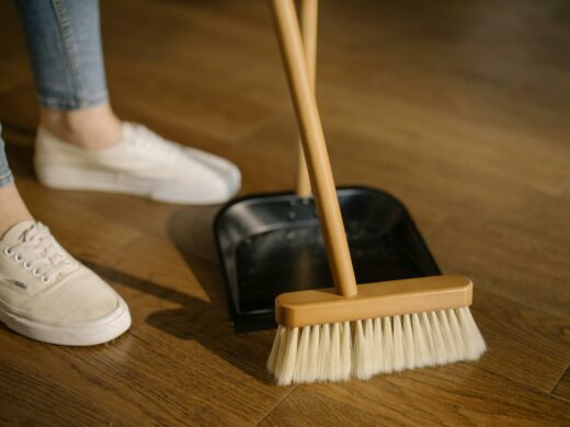 person sweeping with broom
